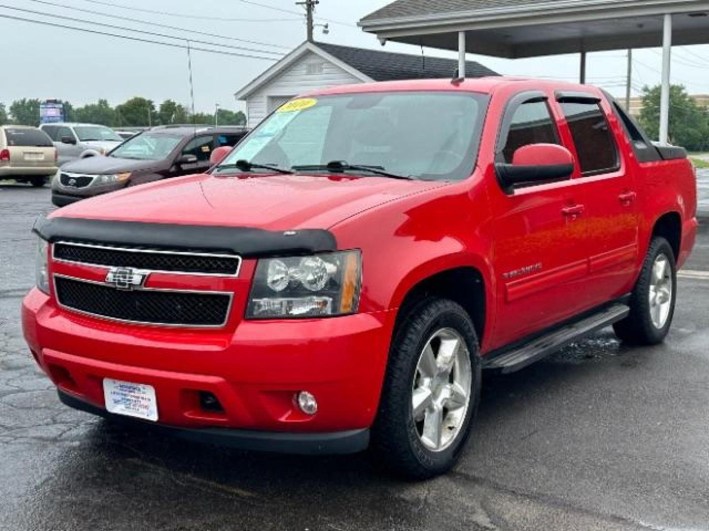 2010 Victory Red Chevrolet Avalanche LT 4WD (3GNVKFE09AG) with an 5.3L V8 OHV 16V FFV engine, 4-Speed Automatic transmission, located at 880 E. National Road, Vandalia, OH, 45377, (937) 908-9800, 39.891918, -84.183594 - Photo#2