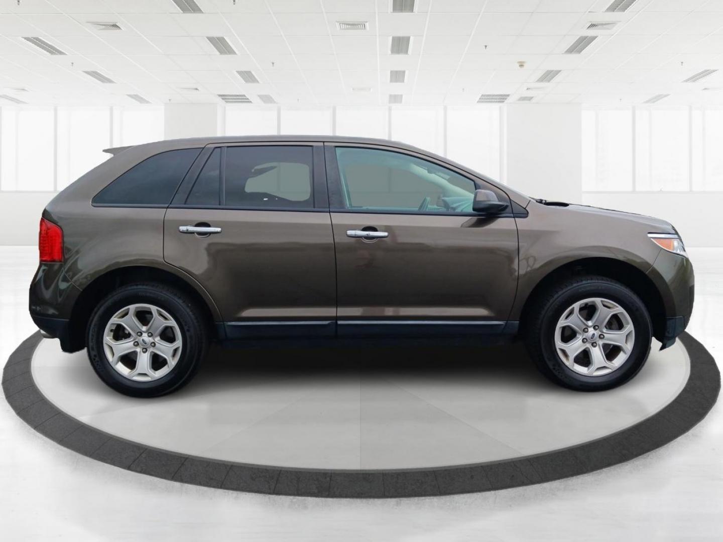 2011 Earth Metallic Ford Edge SEL AWD (2FMDK4JC9BB) with an 3.5L V6 DOHC 24V engine, 6-Speed Automatic transmission, located at 1184 Kauffman Ave, Fairborn, OH, 45324, (937) 908-9800, 39.807072, -84.030914 - Photo#1