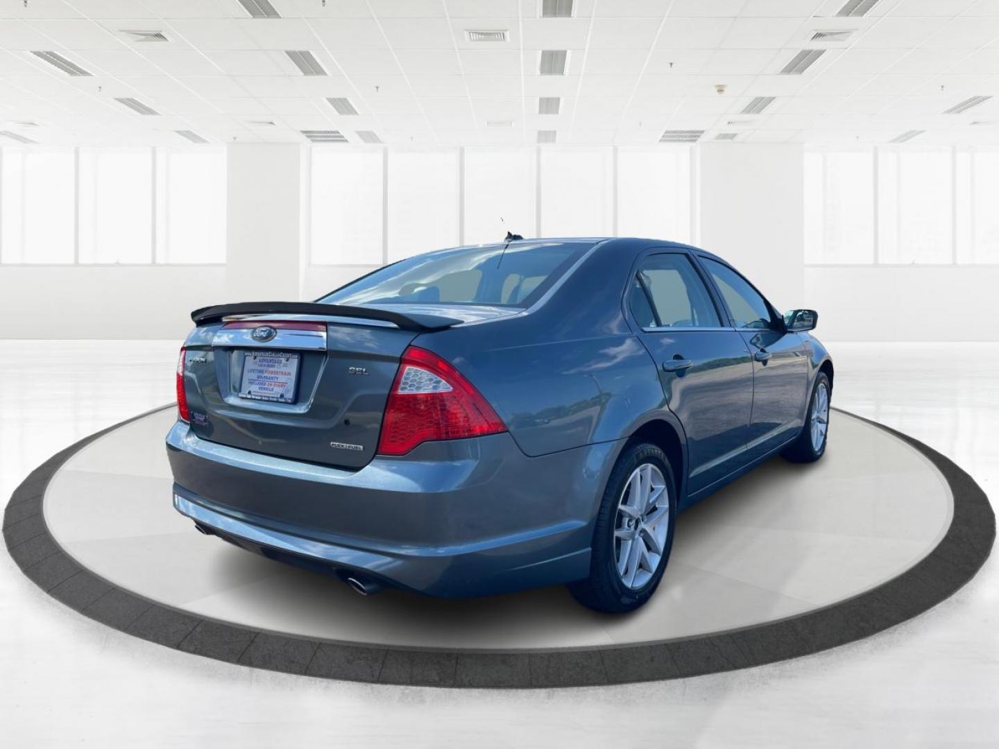 2011 Blue Ford Fusion V6 SEL (3FAHP0JG0BR) with an 3.0L V6 DOHC 24V engine, located at 1184 Kauffman Ave, Fairborn, OH, 45324, (937) 908-9800, 39.807072, -84.030914 - Photo#2