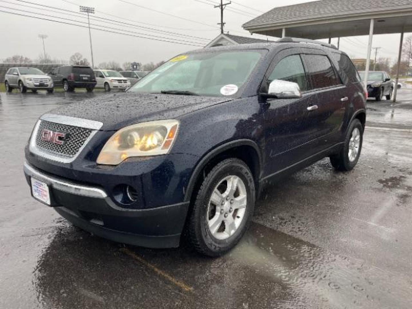 2011 Dark Blue Metallic GMC Acadia SLE-1 AWD (1GKKVNED3BJ) with an 3.6L V6 DOHC 24V engine, 6-Speed Automatic transmission, located at 880 E. National Road, Vandalia, OH, 45377, (937) 908-9800, 39.891918, -84.183594 - Photo#1