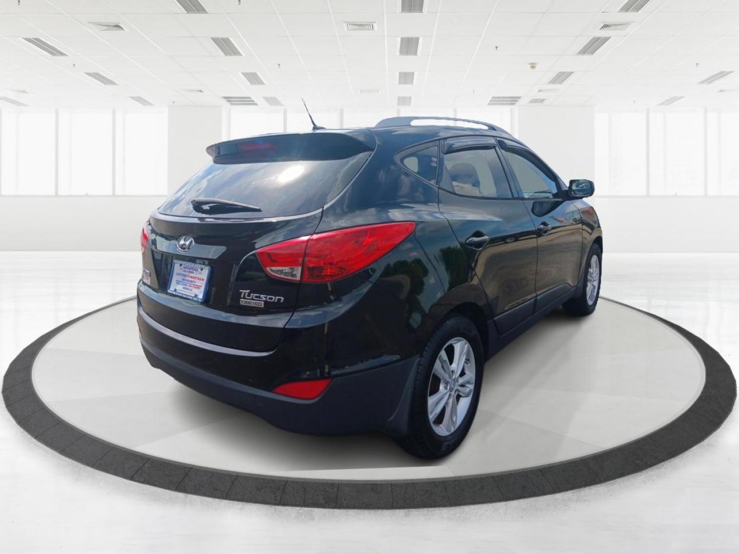 2011 Ash Black Mica Hyundai Tucson (KM8JU3AC8BU) with an 2.4L L4 DOHC 16V engine, 6-Speed Automatic transmission, located at 1099 N County Rd 25A , Troy, OH, 45373, (937) 908-9800, 40.057079, -84.212883 - Photo#2