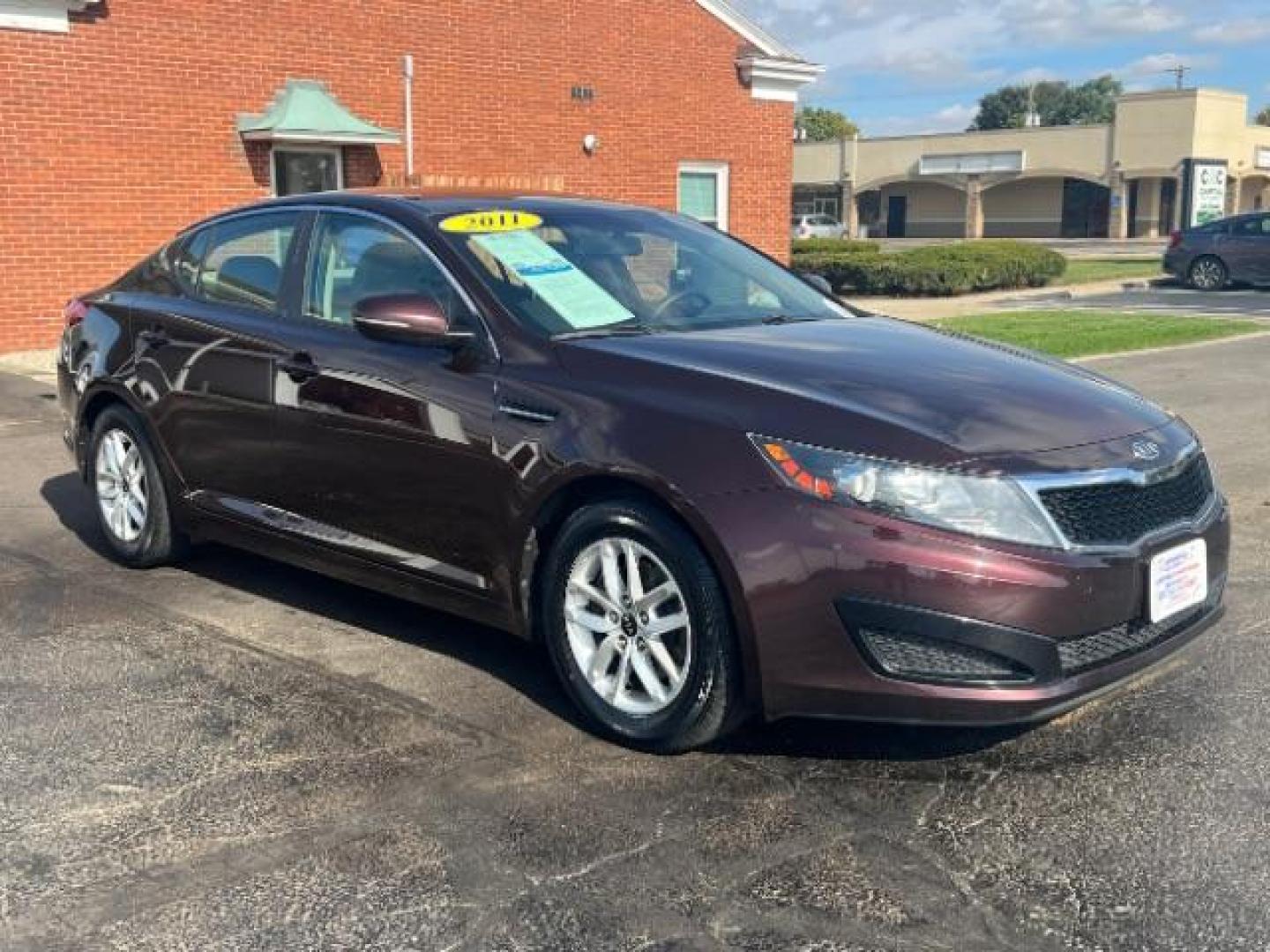 2011 Dark Cherry Kia Optima LX AT (KNAGM4A72B5) with an 2.4L L4 DOHC 16V engine, 6-Speed Automatic transmission, located at 1951 S Dayton Lakeview Rd., New Carlisle, OH, 45344, (937) 908-9800, 39.890999, -84.050255 - Photo#0