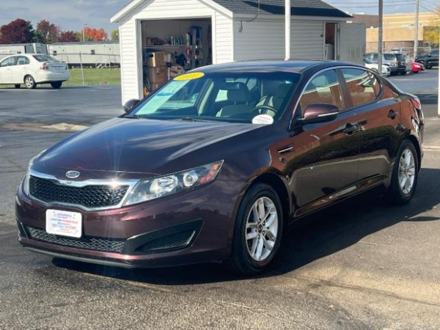 2011 Dark Cherry Kia Optima LX AT (KNAGM4A72B5) with an 2.4L L4 DOHC 16V engine, 6-Speed Automatic transmission, located at 1951 S Dayton Lakeview Rd., New Carlisle, OH, 45344, (937) 908-9800, 39.890999, -84.050255 - Photo#1