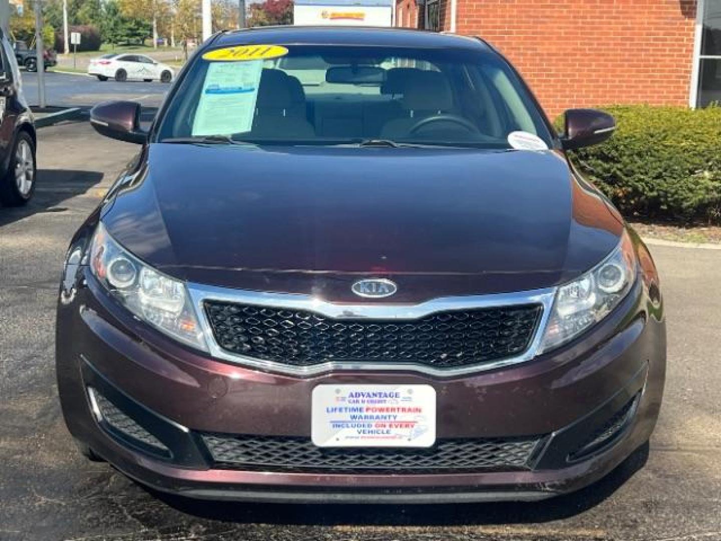 2011 Dark Cherry Kia Optima LX AT (KNAGM4A72B5) with an 2.4L L4 DOHC 16V engine, 6-Speed Automatic transmission, located at 1951 S Dayton Lakeview Rd., New Carlisle, OH, 45344, (937) 908-9800, 39.890999, -84.050255 - Photo#2