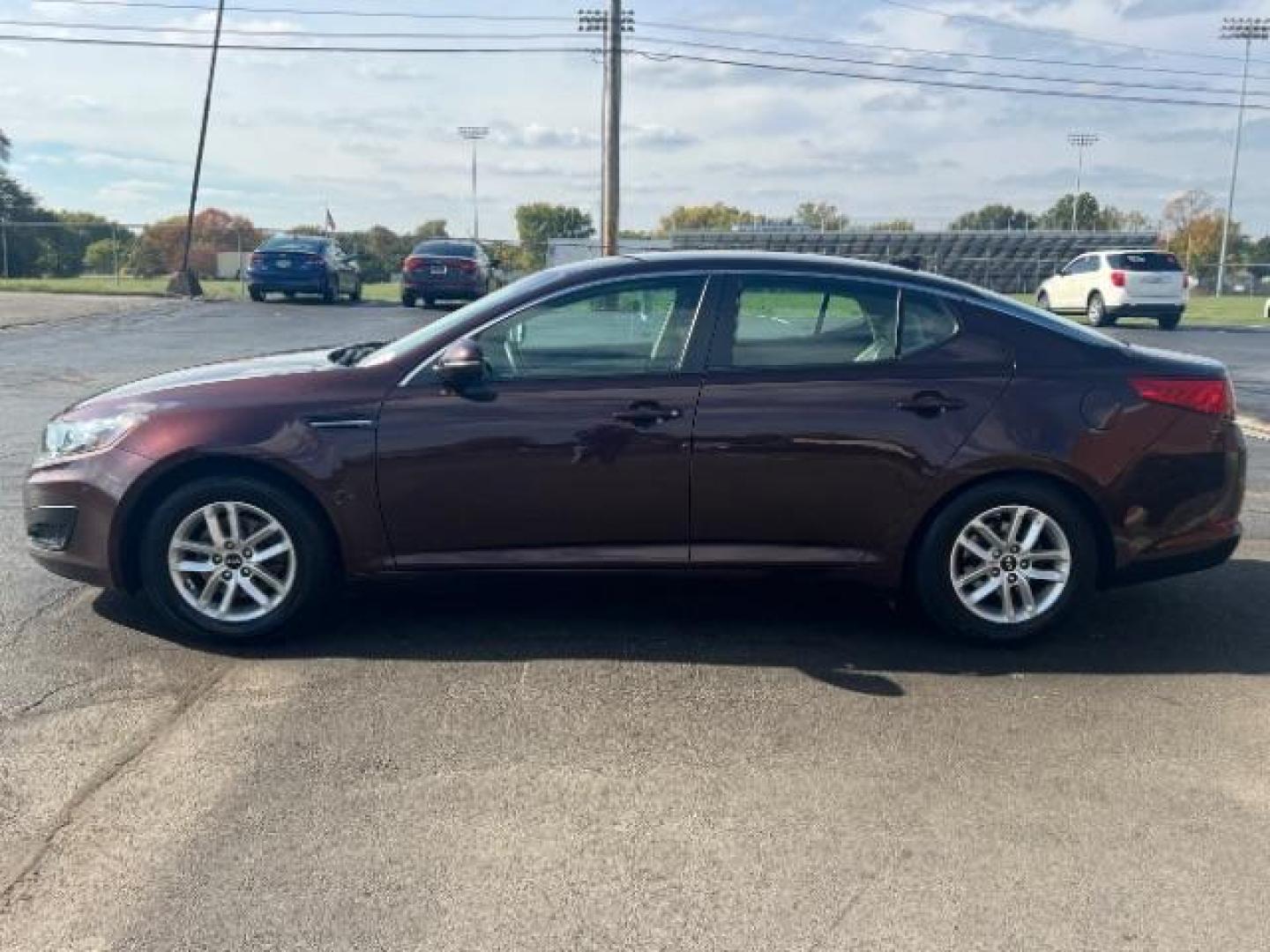 2011 Dark Cherry Kia Optima LX AT (KNAGM4A72B5) with an 2.4L L4 DOHC 16V engine, 6-Speed Automatic transmission, located at 1951 S Dayton Lakeview Rd., New Carlisle, OH, 45344, (937) 908-9800, 39.890999, -84.050255 - Photo#3