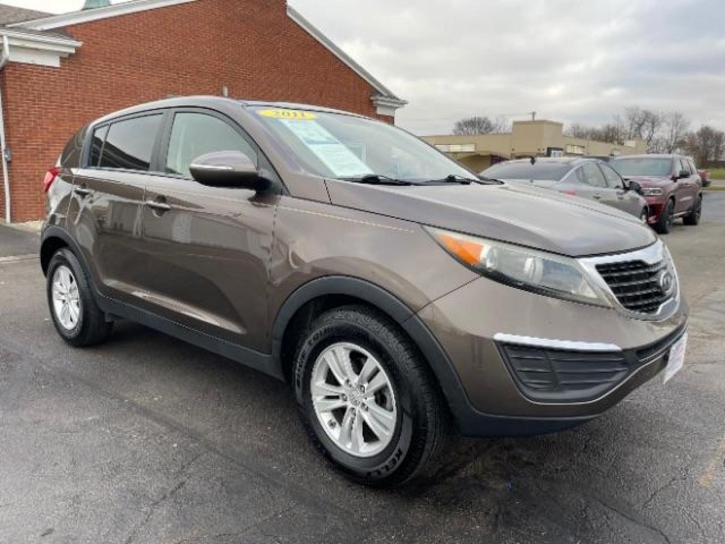 2011 Sand Track Kia Sportage LX FWD (KNDPB3A29B7) with an 2.4L V6 DOHC 24V engine, 6-Speed Automatic transmission, located at 401 Woodman Dr, Riverside, OH, 45431, (937) 908-9800, 39.760899, -84.123421 - Photo#0