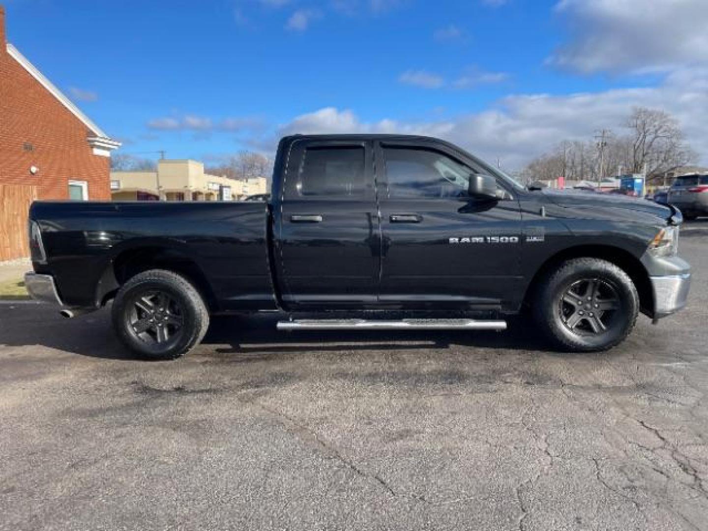 2011 Brilliant Black Crystal Pearl RAM 1500 Sport Quad Cab 4WD (1D7RV1GT2BS) with an 5.7L V8 OHV 16V engine, 5-Speed Automatic transmission, located at 401 Woodman Dr, Riverside, OH, 45431, (937) 908-9800, 39.760899, -84.123421 - Photo#3