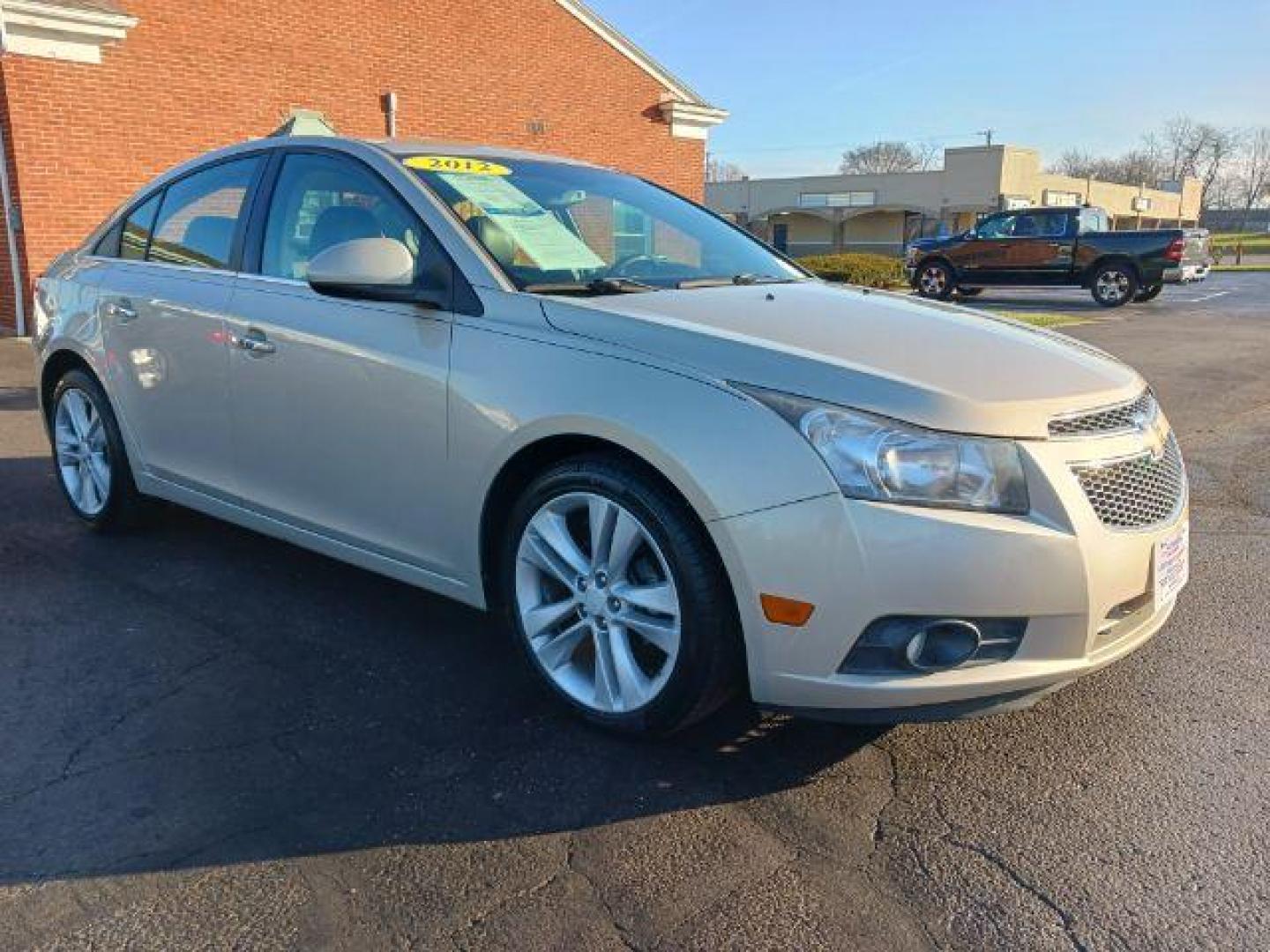 2012 Gold Mist Metallic Chevrolet Cruze LTZ (1G1PH5SC3C7) with an 1.4L L4 DOHC 16V TURBO engine, 6-Speed Automatic transmission, located at 4508 South Dixie Dr, Moraine, OH, 45439, (937) 908-9800, 39.689976, -84.218452 - Photo#0