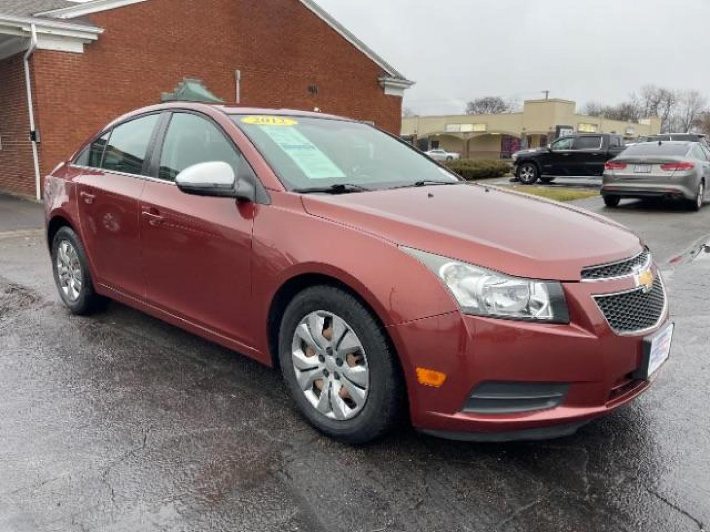 2012 Orange Chevrolet Cruze 2LS (1G1PC5SH1C7) with an 1.8L L4 DOHC 16V FFV engine, 6-Speed Automatic transmission, located at 4508 South Dixie Dr, Moraine, OH, 45439, (937) 908-9800, 39.689976, -84.218452 - Photo#0