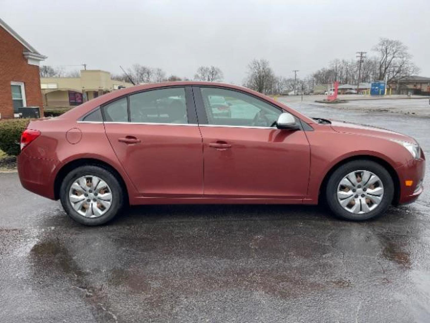 2012 Orange Chevrolet Cruze 2LS (1G1PC5SH1C7) with an 1.8L L4 DOHC 16V FFV engine, 6-Speed Automatic transmission, located at 4508 South Dixie Dr, Moraine, OH, 45439, (937) 908-9800, 39.689976, -84.218452 - Photo#5