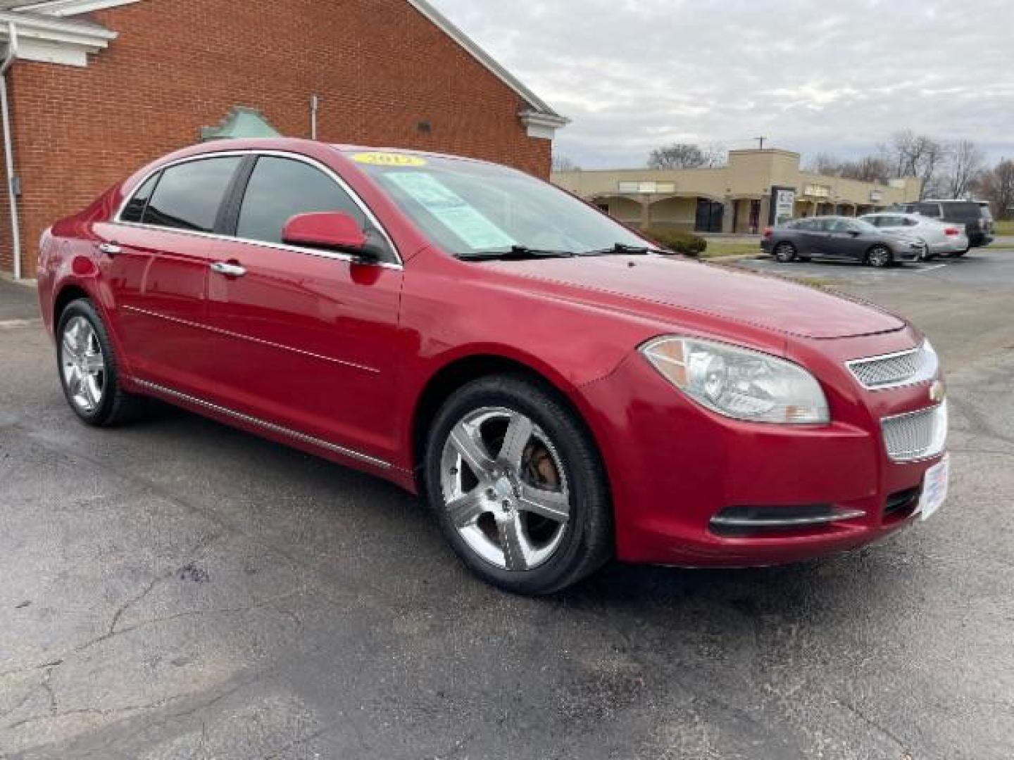 2012 Red Chevrolet Malibu 1LT (1G1ZC5E0XCF) with an 2.4L L4 DOHC 16V engine, 6-Speed Automatic transmission, located at 401 Woodman Dr, Riverside, OH, 45431, (937) 908-9800, 39.760899, -84.123421 - Photo#0