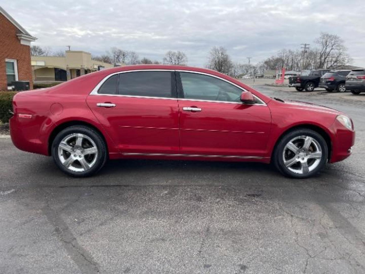 2012 Red Chevrolet Malibu 1LT (1G1ZC5E0XCF) with an 2.4L L4 DOHC 16V engine, 6-Speed Automatic transmission, located at 401 Woodman Dr, Riverside, OH, 45431, (937) 908-9800, 39.760899, -84.123421 - Photo#3