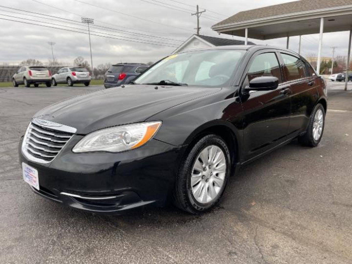 2012 Black Chrysler 200 LX (1C3CCBAB4CN) with an 2.4L L4 DOHC 16V engine, 6-Speed Automatic transmission, located at 880 E. National Road, Vandalia, OH, 45377, (937) 908-9800, 39.891918, -84.183594 - Photo#1