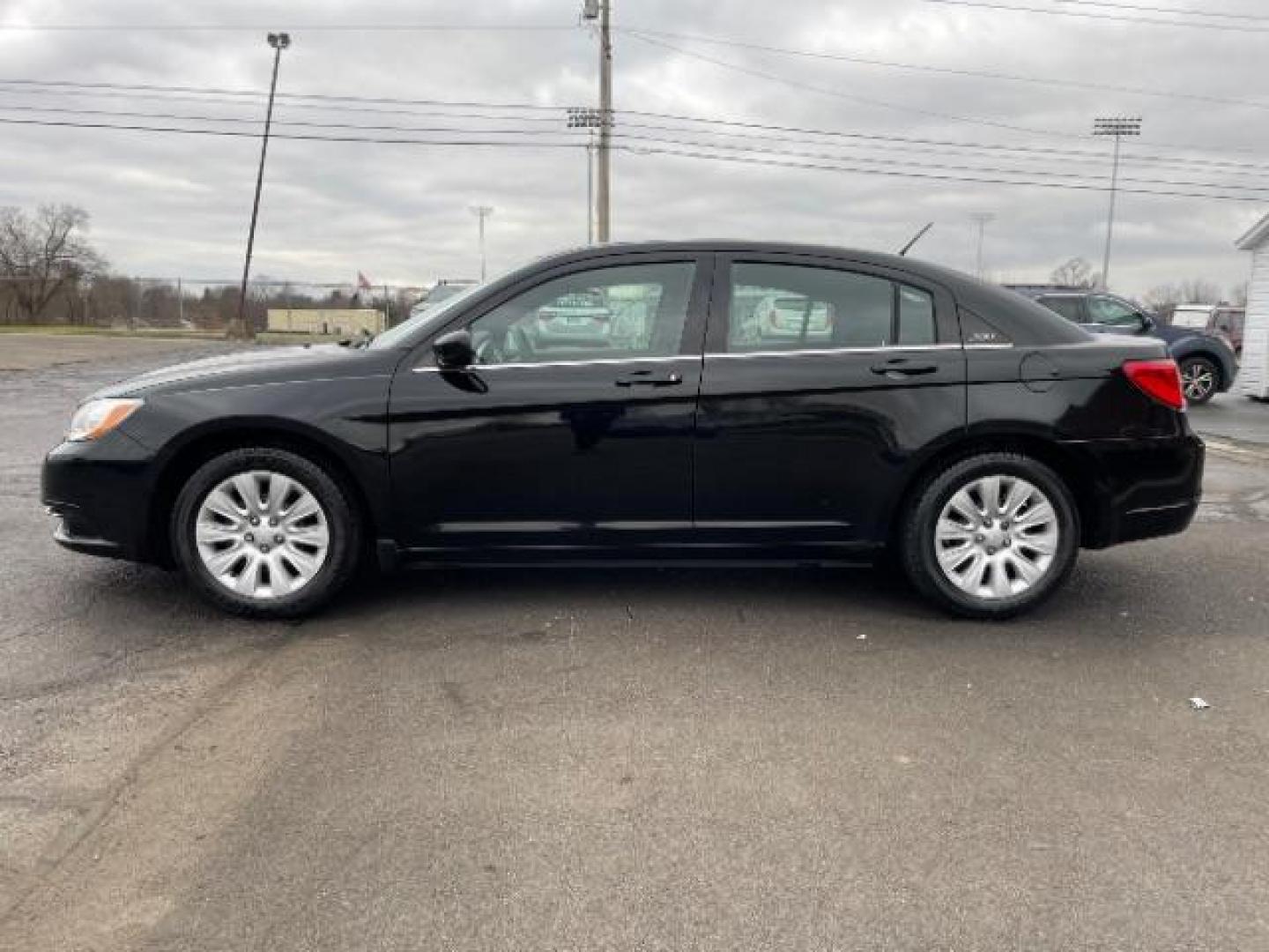 2012 Black Chrysler 200 LX (1C3CCBAB4CN) with an 2.4L L4 DOHC 16V engine, 6-Speed Automatic transmission, located at 880 E. National Road, Vandalia, OH, 45377, (937) 908-9800, 39.891918, -84.183594 - Photo#2