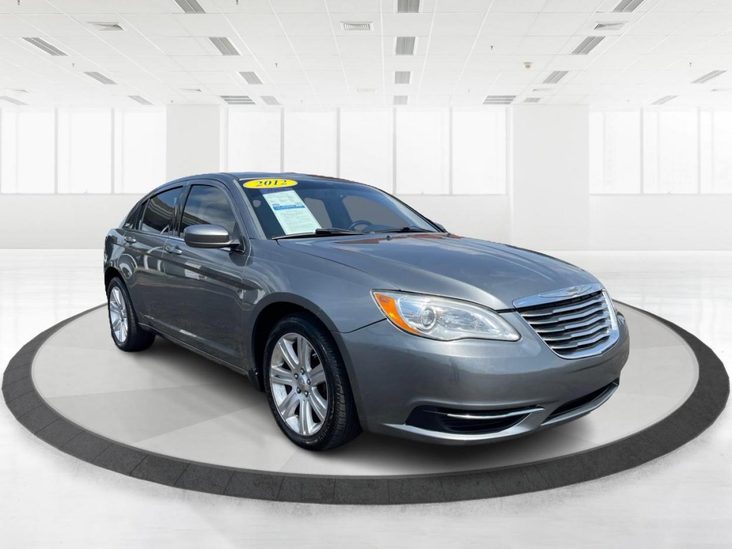 2012 Tungsten Metallic Chrysler 200 Touring (1C3CCBBB1CN) with an 2.4L L4 DOHC 16V engine, 6-Speed Automatic transmission, located at 880 E. National Road, Vandalia, OH, 45377, (937) 908-9800, 39.891918, -84.183594 - Photo#0