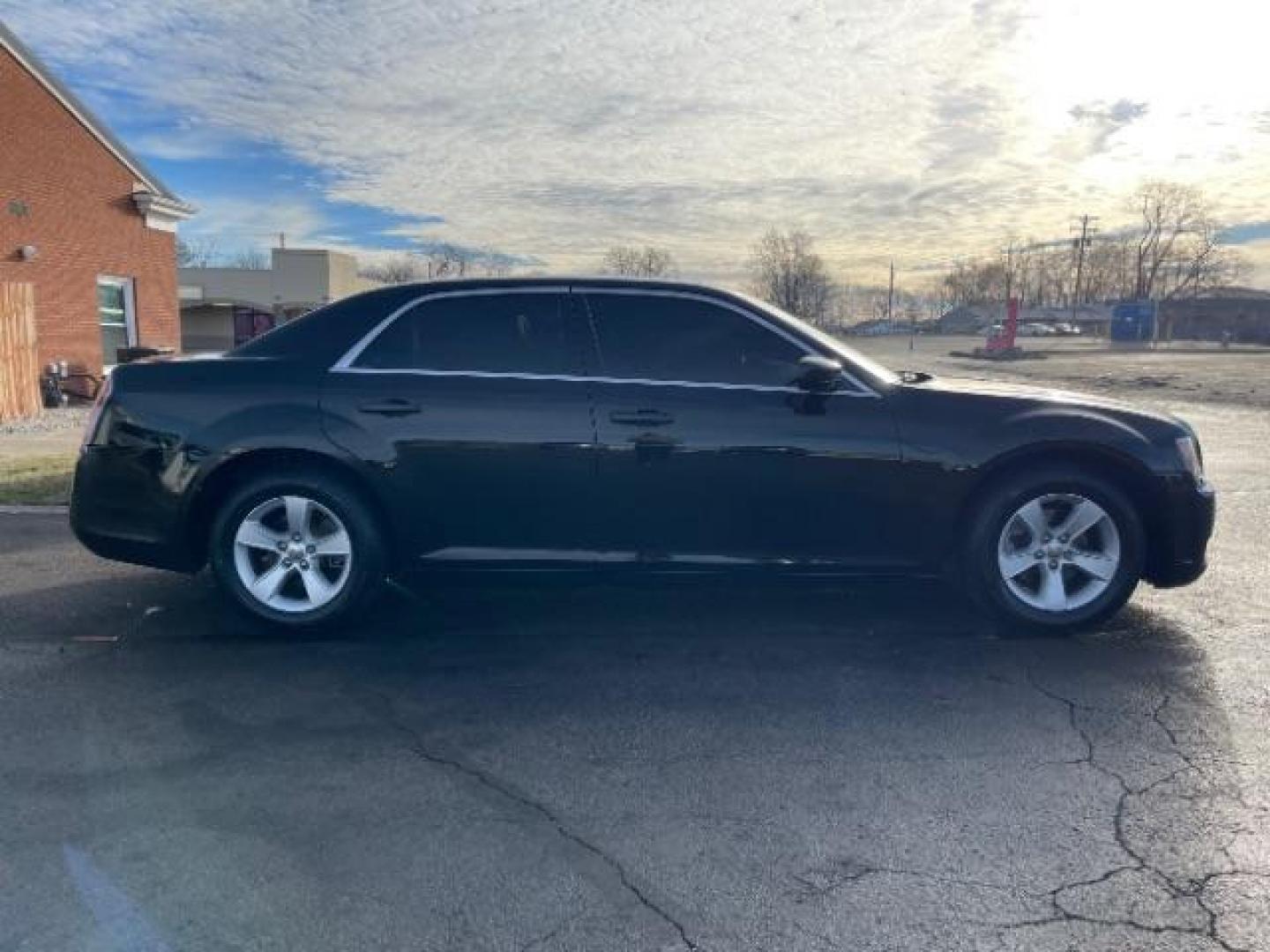 2012 Gloss Black Chrysler 300 Base (2C3CCAAG2CH) with an 3.6L V6 SOHC 24V engine, 5-Speed Automatic transmission, located at 401 Woodman Dr, Riverside, OH, 45431, (937) 908-9800, 39.760899, -84.123421 - Photo#2