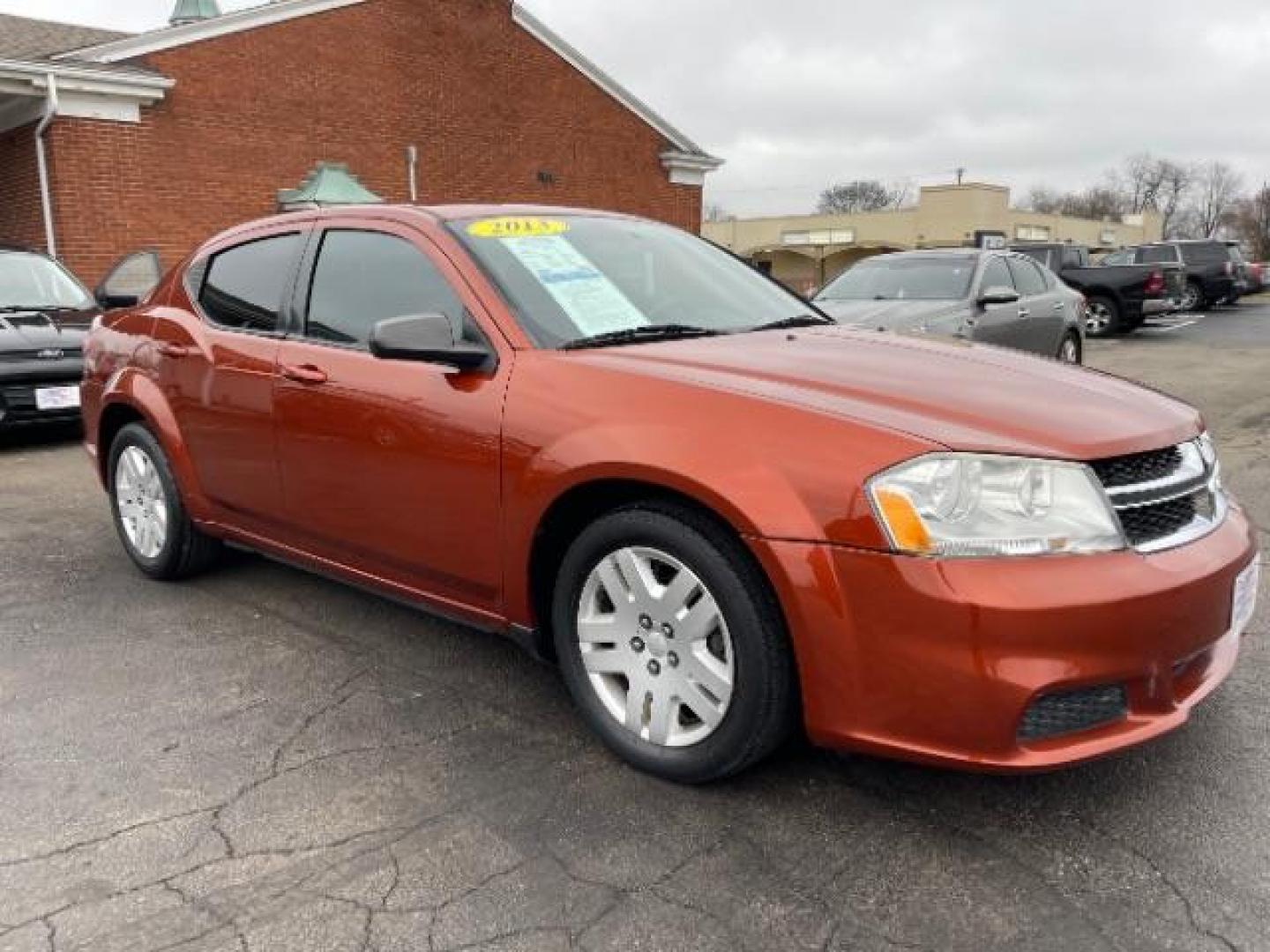 2012 Orange Dodge Avenger Base (1C3CDZAB1CN) with an 2.4L L4 DOHC 16V engine, 4-Speed Automatic transmission, located at 4508 South Dixie Dr, Moraine, OH, 45439, (937) 908-9800, 39.689976, -84.218452 - Photo#0