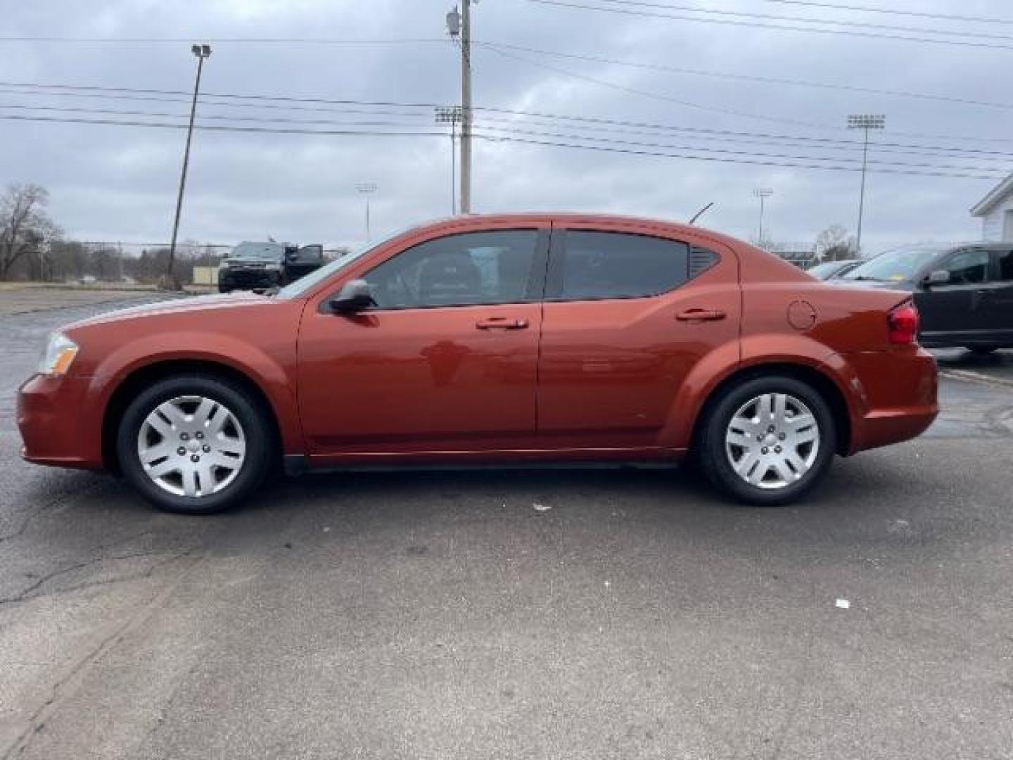 2012 Orange Dodge Avenger Base (1C3CDZAB1CN) with an 2.4L L4 DOHC 16V engine, 4-Speed Automatic transmission, located at 4508 South Dixie Dr, Moraine, OH, 45439, (937) 908-9800, 39.689976, -84.218452 - Photo#2