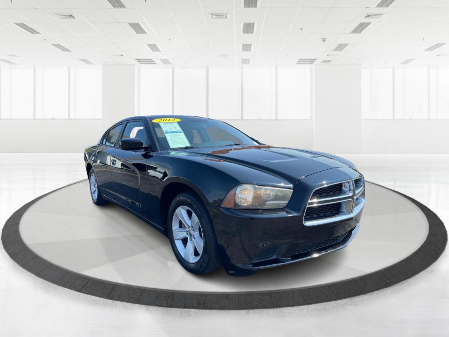 2012 Pitch Black Dodge Charger SE (2C3CDXBGXCH) with an 3.6L V6 DOHC 24V engine, 5-Speed Automatic transmission, located at 1951 S Dayton Lakeview Rd., New Carlisle, OH, 45344, (937) 908-9800, 39.890999, -84.050255 - Photo#0