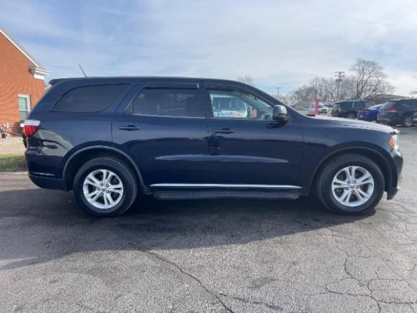 2012 True Blue Pearl Dodge Durango SXT AWD (1C4RDJAGXCC) with an 3.6L V6 DOHC 24V engine, 5-Speed Automatic transmission, located at 401 Woodman Dr, Riverside, OH, 45431, (937) 908-9800, 39.760899, -84.123421 - Photo#2