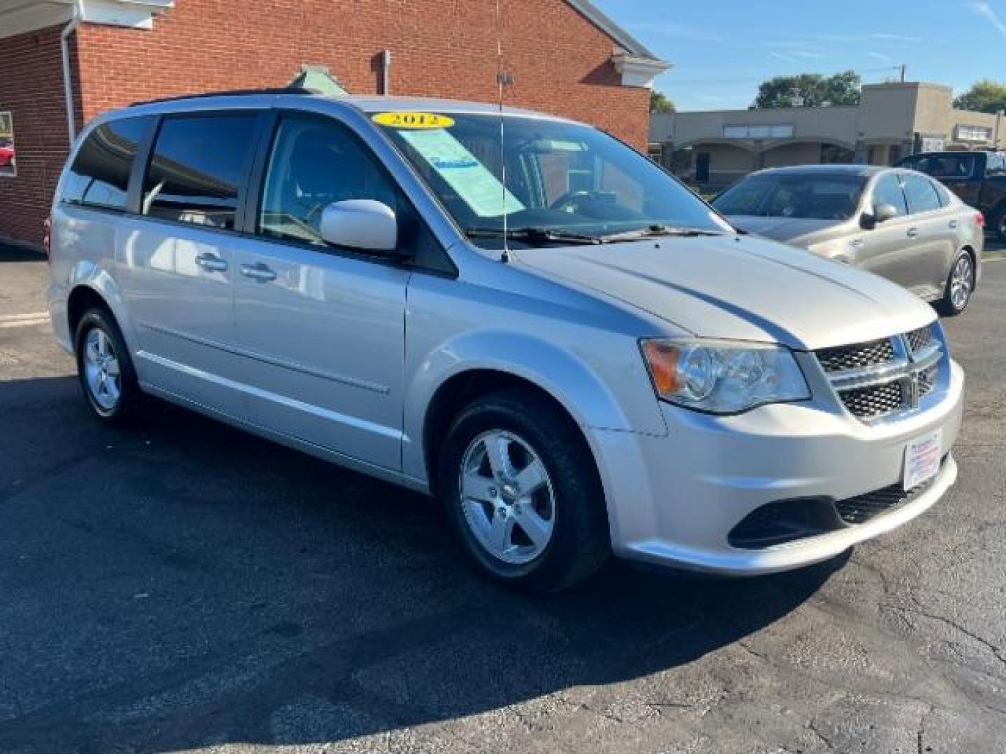 2012 Bright Silver Metallic Dodge Grand Caravan SXT (2C4RDGCG8CR) with an 3.6L V6 DOHC 24V engine, 6-Speed Automatic transmission, located at 880 E. National Road, Vandalia, OH, 45377, (937) 908-9800, 39.891918, -84.183594 - Photo#0