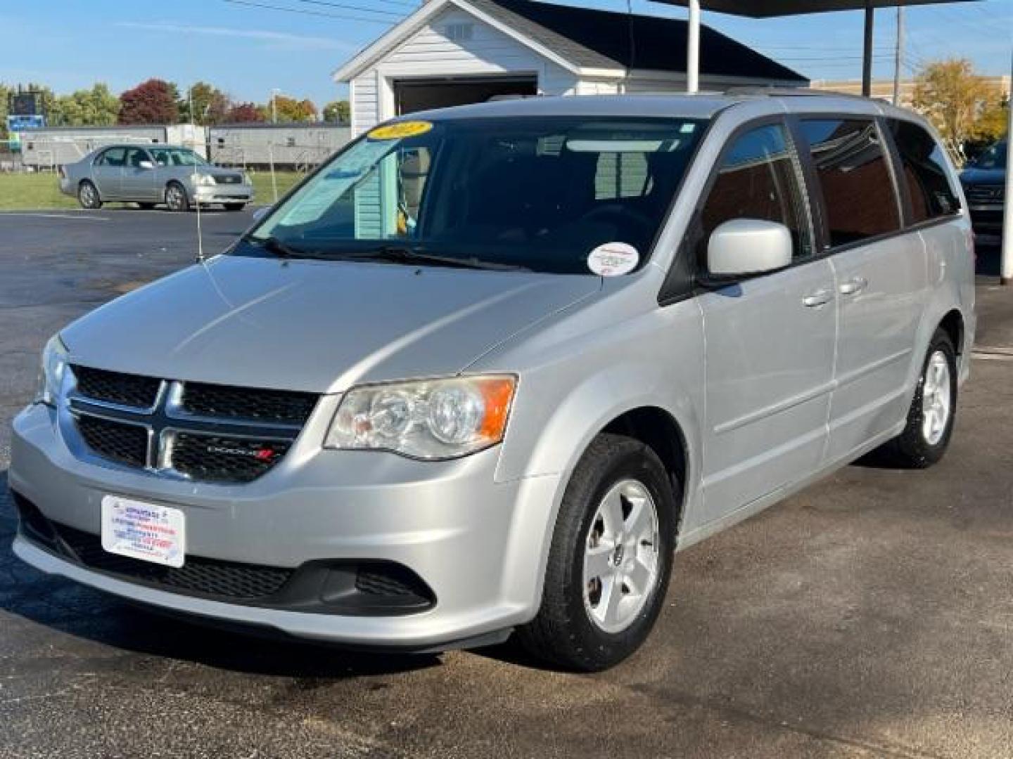 2012 Bright Silver Metallic Dodge Grand Caravan SXT (2C4RDGCG8CR) with an 3.6L V6 DOHC 24V engine, 6-Speed Automatic transmission, located at 880 E. National Road, Vandalia, OH, 45377, (937) 908-9800, 39.891918, -84.183594 - Photo#2