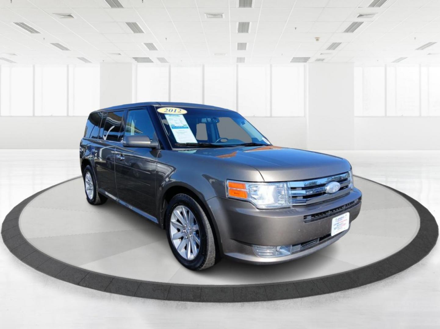 2012 Mineral Gray Metallic Ford Flex SEL FWD (2FMGK5CC2CB) with an 3.5L V6 DOHC 24V engine, 6-Speed Automatic Overdrive transmission, located at 1184 Kauffman Ave, Fairborn, OH, 45324, (937) 908-9800, 39.807072, -84.030914 - Photo#0