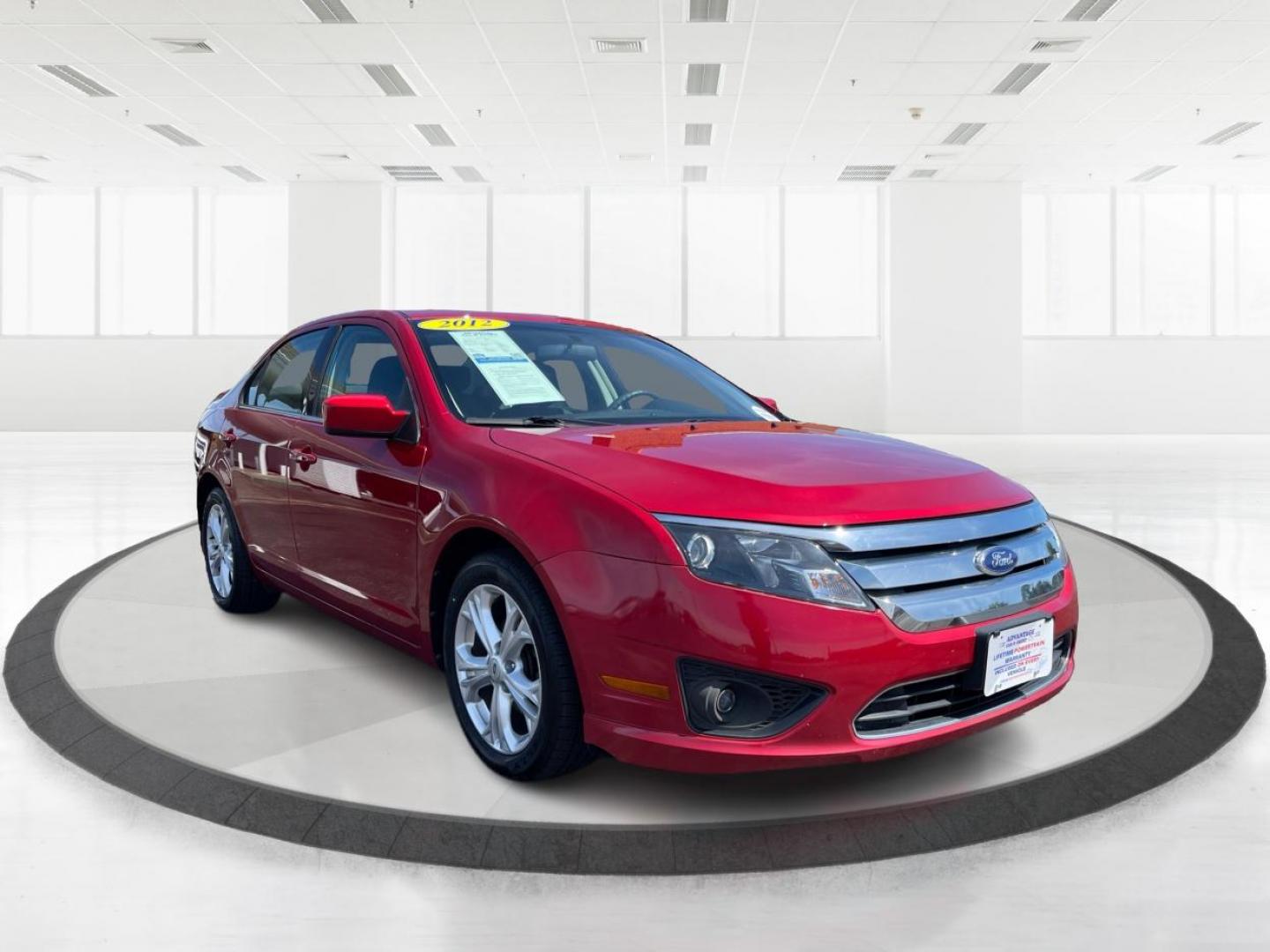 2012 Red Candy Metallic Ford Fusion (3FAHP0HA5CR) with an 2.5L L4 DOHC 16V engine, located at 1184 Kauffman Ave, Fairborn, OH, 45324, (937) 908-9800, 39.807072, -84.030914 - Photo#0