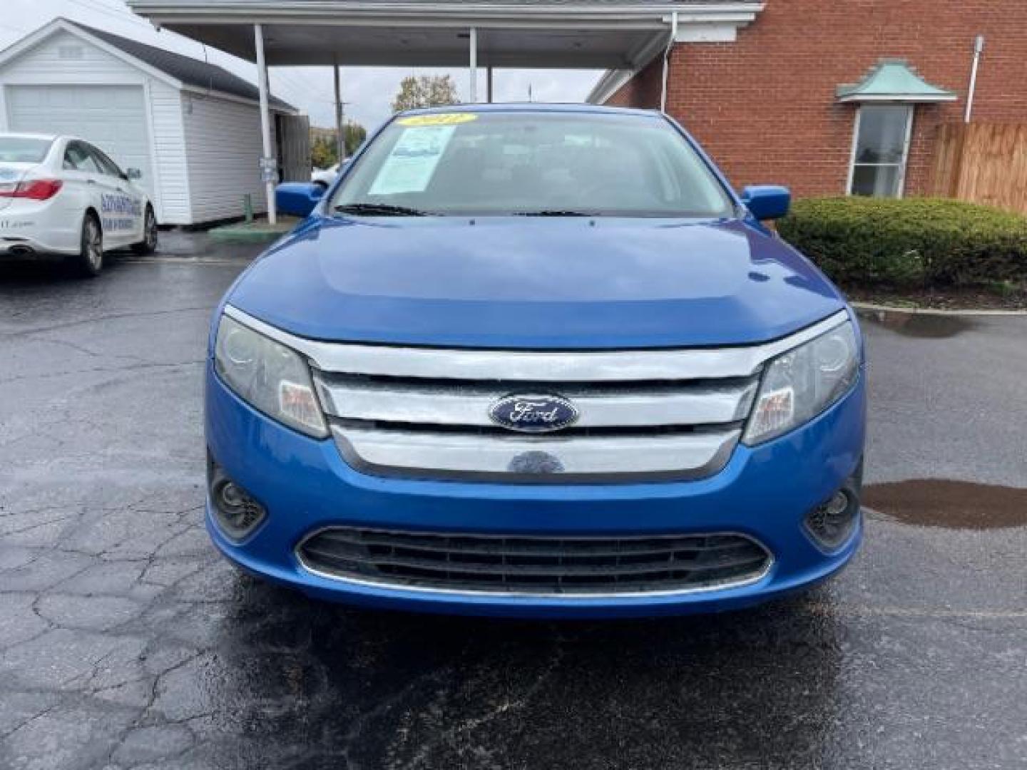 2012 Blue Flame Metallic Ford Fusion SE (3FAHP0HG6CR) with an 3.0L V6 DOHC 24V engine, located at 401 Woodman Dr, Riverside, OH, 45431, (937) 908-9800, 39.760899, -84.123421 - Photo#2