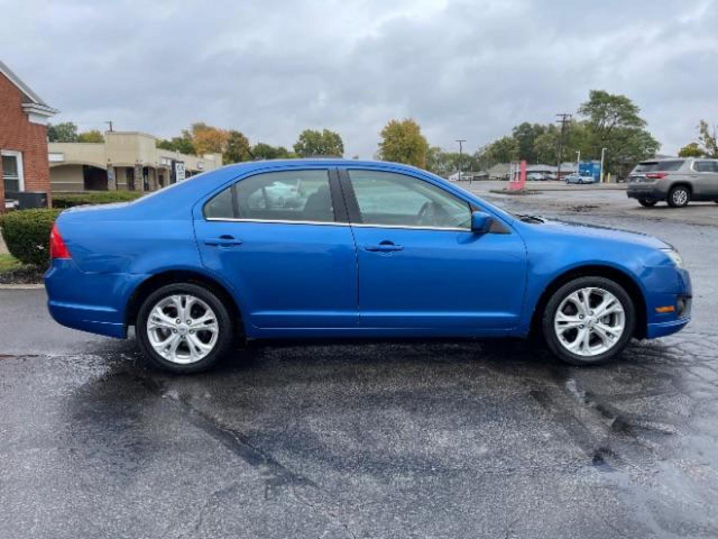 2012 Blue Flame Metallic Ford Fusion SE (3FAHP0HG6CR) with an 3.0L V6 DOHC 24V engine, located at 401 Woodman Dr, Riverside, OH, 45431, (937) 908-9800, 39.760899, -84.123421 - Photo#4