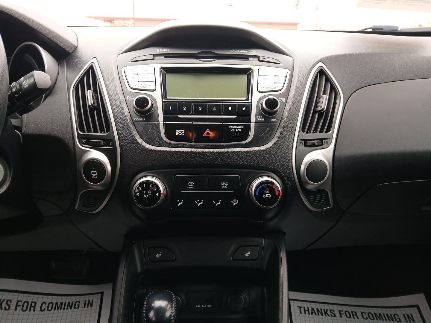 2012 Hyundai Tucson GLS AWD (KM8JUCACXCU) with an 2.4L L4 DOHC 16V engine, 6-Speed Automatic transmission, located at 1099 N County Rd 25A , Troy, OH, 45373, (937) 908-9800, 40.057079, -84.212883 - 2012 Hyundai Tucson GLS AWD - Photo#12