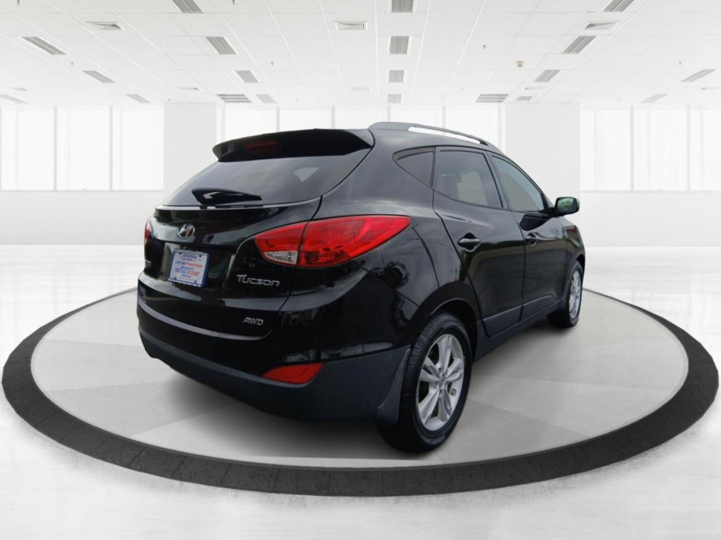 2012 Hyundai Tucson GLS AWD (KM8JUCACXCU) with an 2.4L L4 DOHC 16V engine, 6-Speed Automatic transmission, located at 1099 N County Rd 25A , Troy, OH, 45373, (937) 908-9800, 40.057079, -84.212883 - 2012 Hyundai Tucson GLS AWD - Photo#2