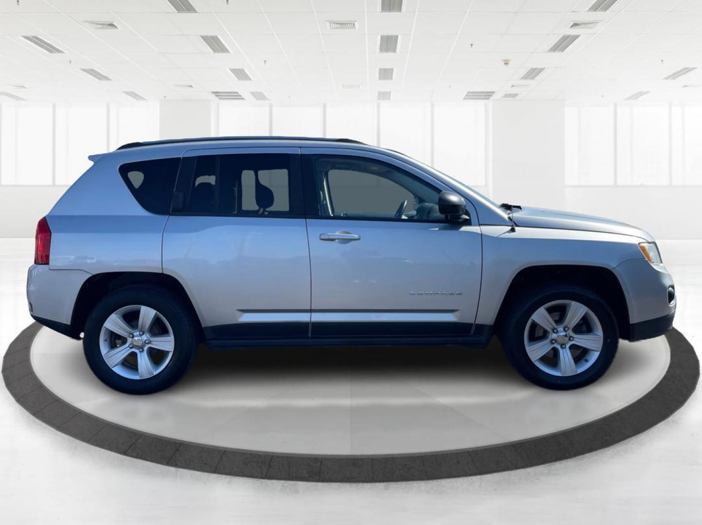 2012 Bright Silver Metallic Jeep Compass Latitude FWD (1C4NJCEB1CD) with an 2.4L L4 DOHC 16V engine, Continuously Variable Transmission transmission, located at 4508 South Dixie Dr, Moraine, OH, 45439, (937) 908-9800, 39.689976, -84.218452 - Photo#1