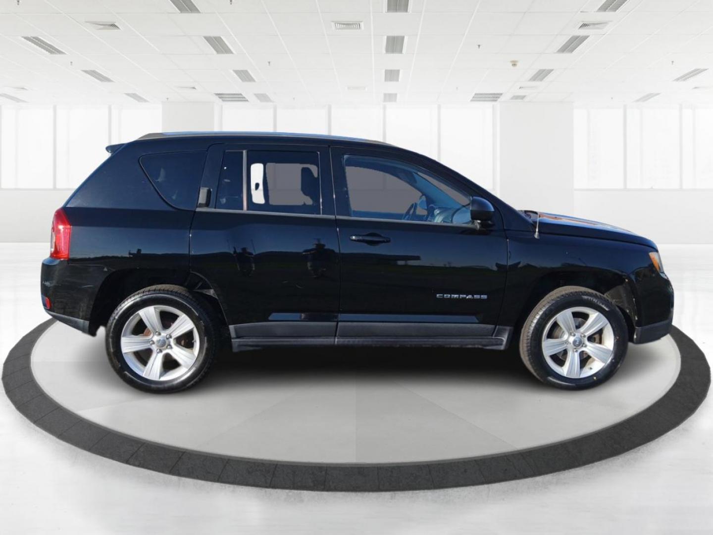 2012 Black Jeep Compass Latitude FWD (1C4NJCEB7CD) with an 2.4L L4 DOHC 16V engine, Continuously Variable Transmission transmission, located at 8750 N County Rd 25A, Piqua, OH, 45356, (937) 908-9800, 40.164391, -84.232513 - Photo#1