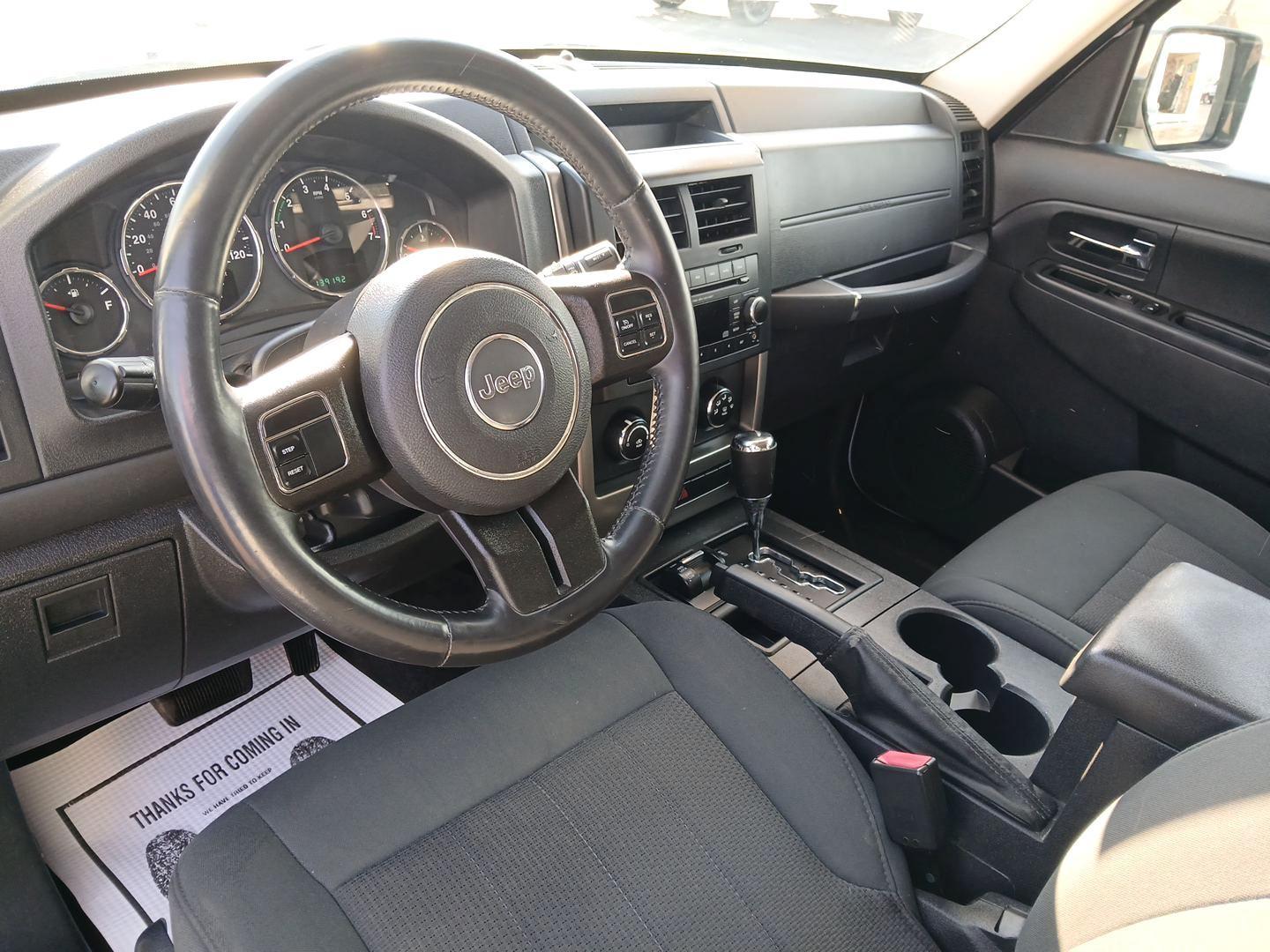 2012 Bright White Jeep Liberty Sport 4WD (1C4PJMAK6CW) with an 3.7L V6 SOHC 12V engine, 4-Speed Automatic transmission, located at 1184 Kauffman Ave, Fairborn, OH, 45324, (937) 908-9800, 39.807072, -84.030914 - Photo#7