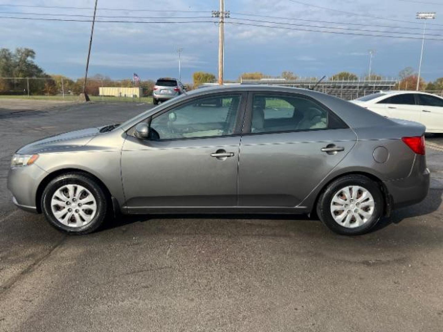 2012 Metal Bronze Metallic Kia Forte EX (KNAFU4A24C5) with an 2.0L L4 DOHC 16V engine, located at 1099 N County Rd 25A , Troy, OH, 45373, (937) 908-9800, 40.057079, -84.212883 - Photo#2