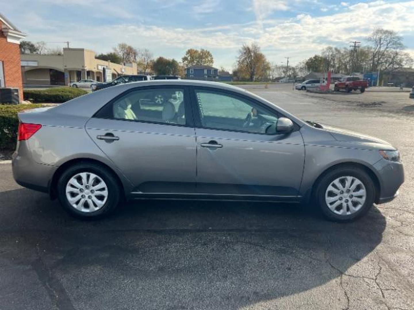 2012 Metal Bronze Metallic Kia Forte EX (KNAFU4A24C5) with an 2.0L L4 DOHC 16V engine, located at 1099 N County Rd 25A , Troy, OH, 45373, (937) 908-9800, 40.057079, -84.212883 - Photo#4