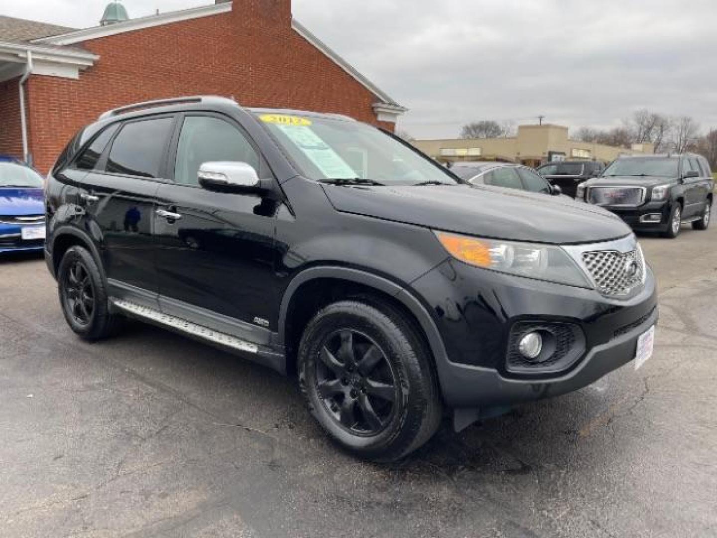 2012 Ebony Black Kia Sorento LX 4WD (5XYKTCA62CG) with an 2.4L L4 DOHC 16V engine, 6-Speed Automatic transmission, located at 880 E. National Road, Vandalia, OH, 45377, (937) 908-9800, 39.891918, -84.183594 - Photo#0