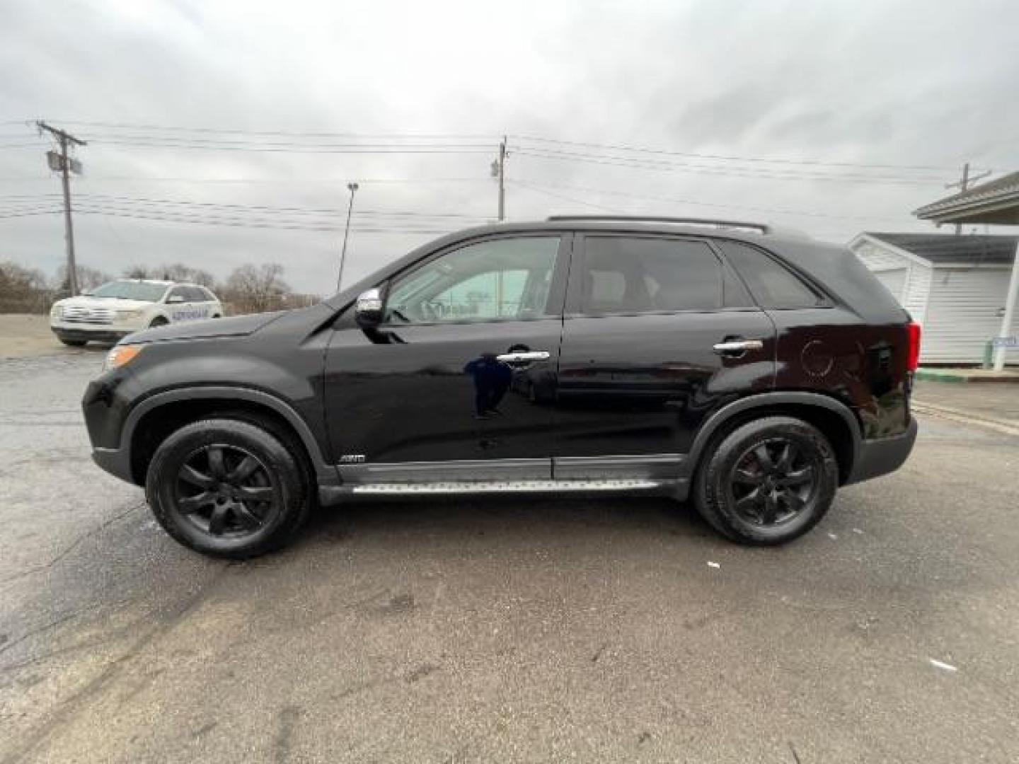 2012 Ebony Black Kia Sorento LX 4WD (5XYKTCA62CG) with an 2.4L L4 DOHC 16V engine, 6-Speed Automatic transmission, located at 880 E. National Road, Vandalia, OH, 45377, (937) 908-9800, 39.891918, -84.183594 - Photo#2