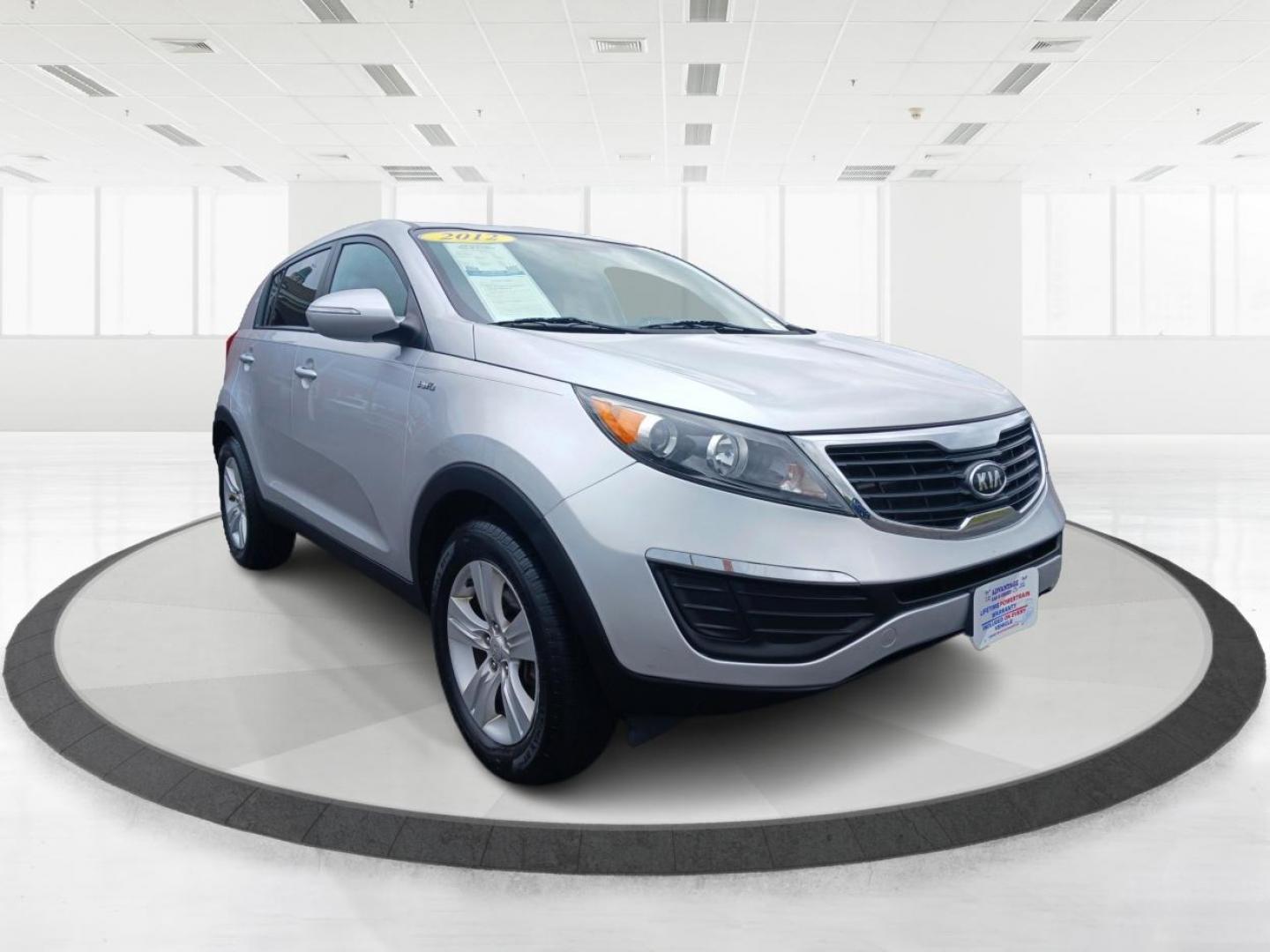 2012 Bright Silver Kia Sportage (KNDPBCA29C7) with an 2.4L V6 DOHC 24V engine, 6-Speed Automatic transmission, located at 1099 N County Rd 25A , Troy, OH, 45373, (937) 908-9800, 40.057079, -84.212883 - Photo#0