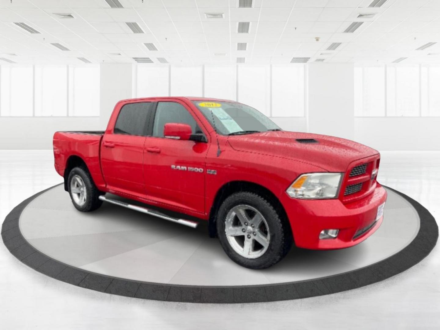 2012 Flame Red RAM 1500 Sport Crew Cab 4WD (1C6RD7MT9CS) with an 5.7L V8 OHV 16V engine, 6-Speed Automatic transmission, located at 1099 N County Rd 25A , Troy, OH, 45373, (937) 908-9800, 40.057079, -84.212883 - Photo#0