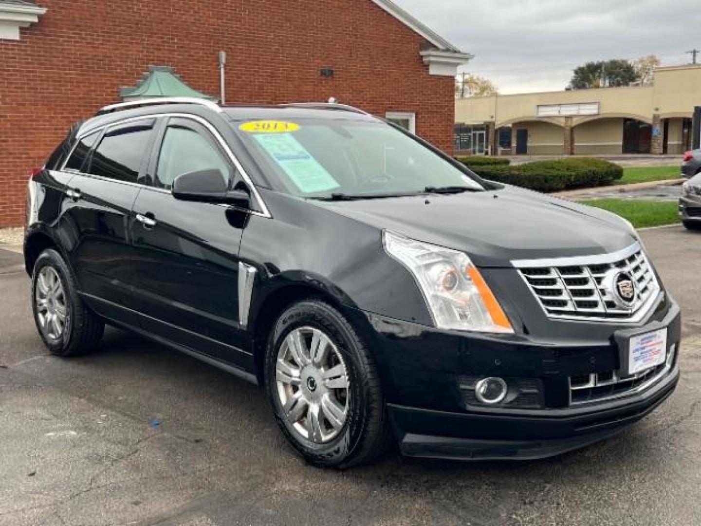 2013 Black Raven Cadillac SRX AWD Luxury Collection (3GYFNGE36DS) with an 3.6L V6 DOHC 24V FFV engine, 6-Speed Automatic transmission, located at 1099 N County Rd 25A , Troy, OH, 45373, (937) 908-9800, 40.057079, -84.212883 - Photo#0