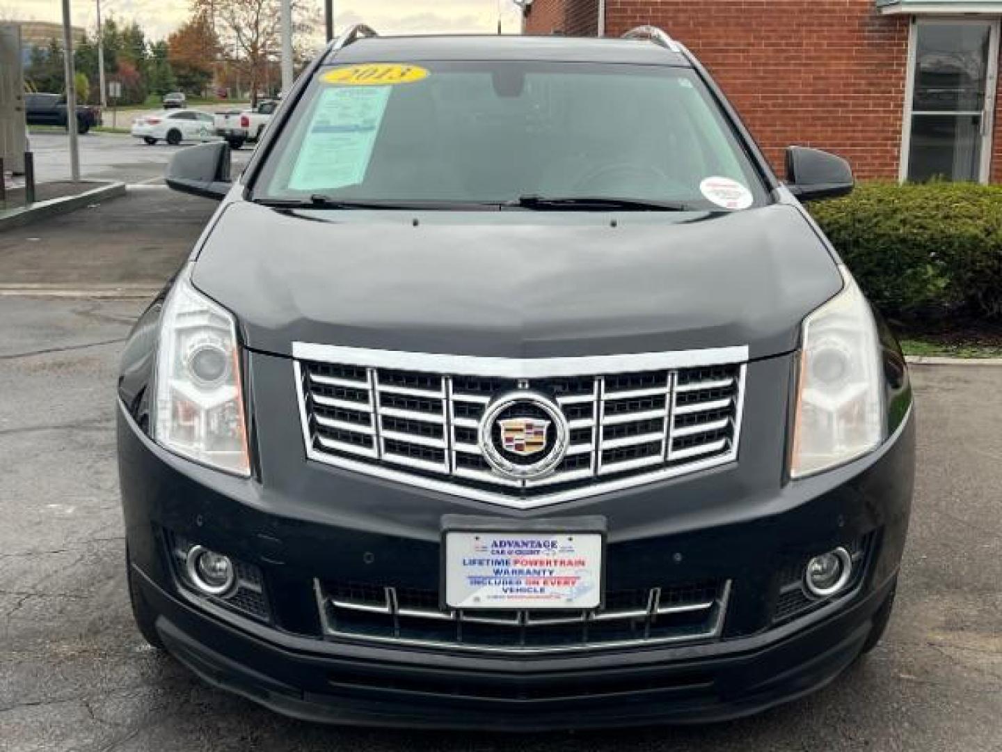 2013 Black Raven Cadillac SRX AWD Luxury Collection (3GYFNGE36DS) with an 3.6L V6 DOHC 24V FFV engine, 6-Speed Automatic transmission, located at 1099 N County Rd 25A , Troy, OH, 45373, (937) 908-9800, 40.057079, -84.212883 - Photo#1