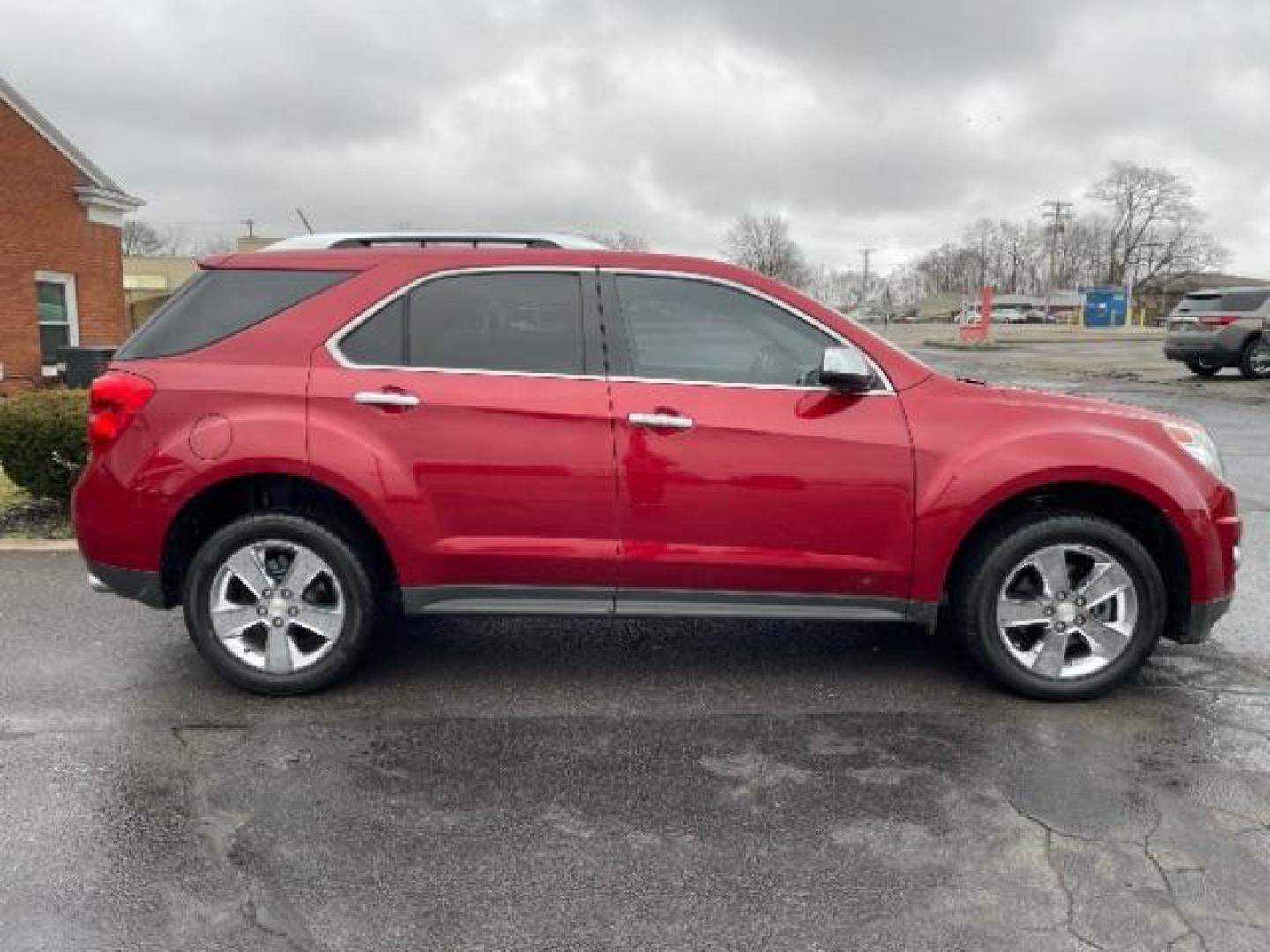 2013 Crystal Red Tintcoat Chevrolet Equinox LTZ AWD (2GNFLGE37D6) with an 3.6L V6 DOHC 24V engine, 6-Speed Automatic transmission, located at 401 Woodman Dr, Riverside, OH, 45431, (937) 908-9800, 39.760899, -84.123421 - Photo#2