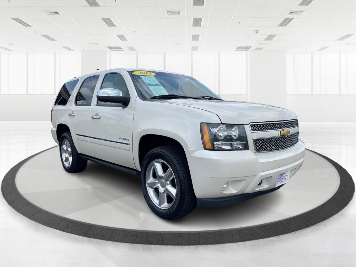 2013 Summit White Chevrolet Tahoe LTZ 4WD (1GNSKCE06DR) with an 5.3L V8 OHV 16V FFV engine, 6-Speed Automatic transmission, located at 8750 N County Rd 25A, Piqua, OH, 45356, (937) 908-9800, 40.164391, -84.232513 - Photo#0