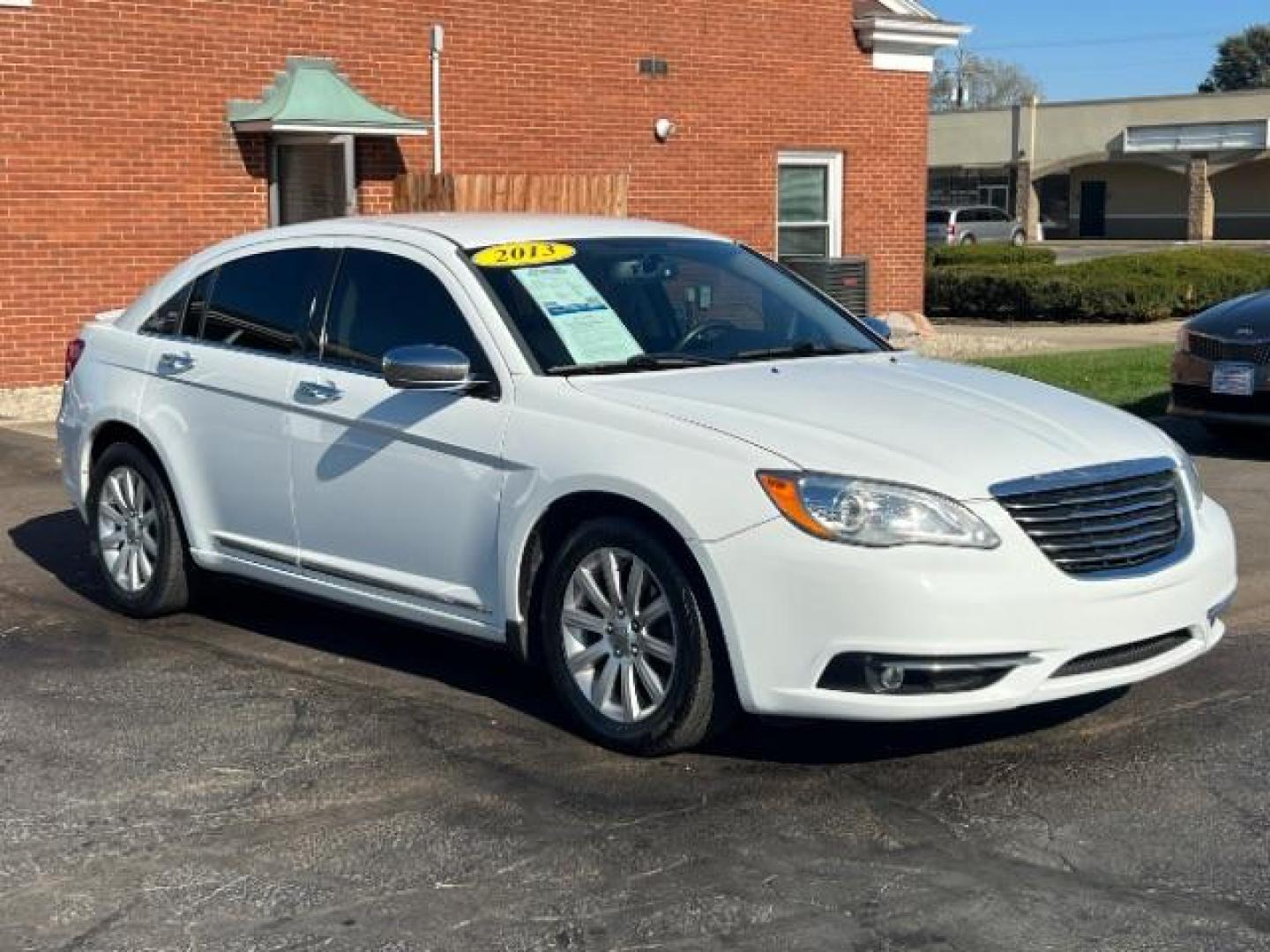 2013 Bright White Chrysler 200 Limited (1C3CCBCG9DN) with an 3.6L V6 DOHC 24V FFV engine, 6-Speed Automatic transmission, located at 1099 N County Rd 25A , Troy, OH, 45373, (937) 908-9800, 40.057079, -84.212883 - Photo#0