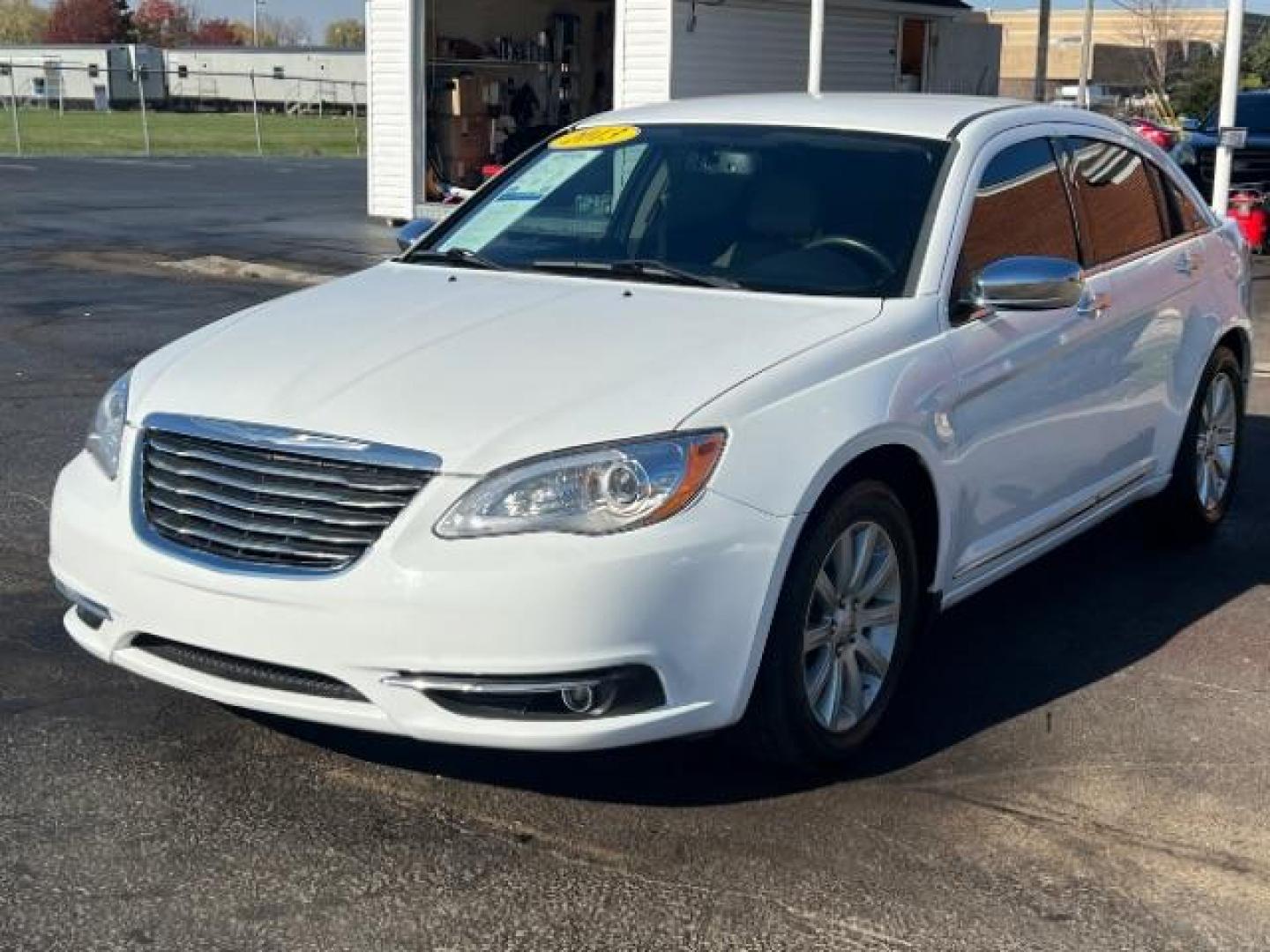 2013 Bright White Chrysler 200 Limited (1C3CCBCG9DN) with an 3.6L V6 DOHC 24V FFV engine, 6-Speed Automatic transmission, located at 1099 N County Rd 25A , Troy, OH, 45373, (937) 908-9800, 40.057079, -84.212883 - Photo#2