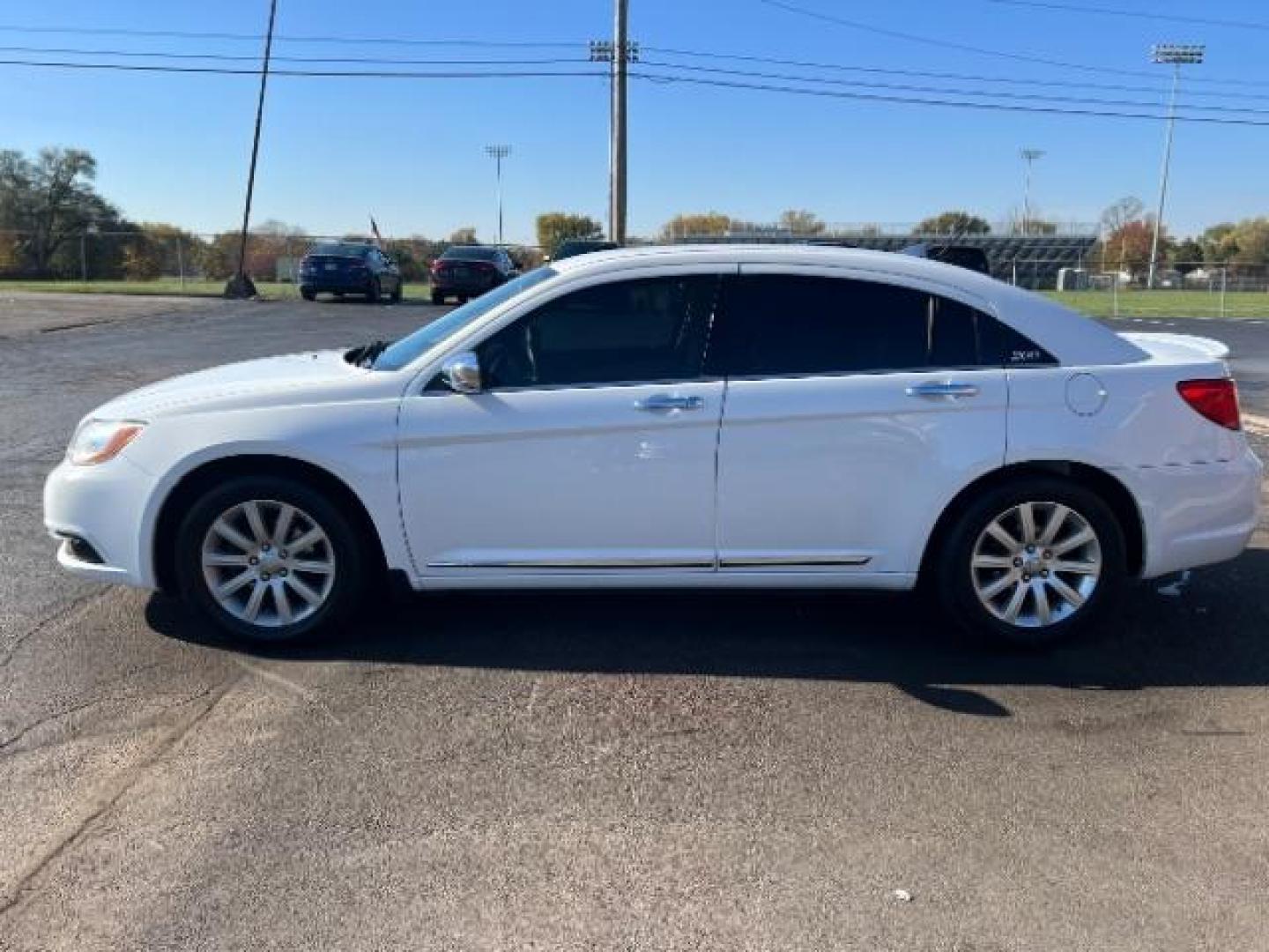 2013 Bright White Chrysler 200 Limited (1C3CCBCG9DN) with an 3.6L V6 DOHC 24V FFV engine, 6-Speed Automatic transmission, located at 1099 N County Rd 25A , Troy, OH, 45373, (937) 908-9800, 40.057079, -84.212883 - Photo#3