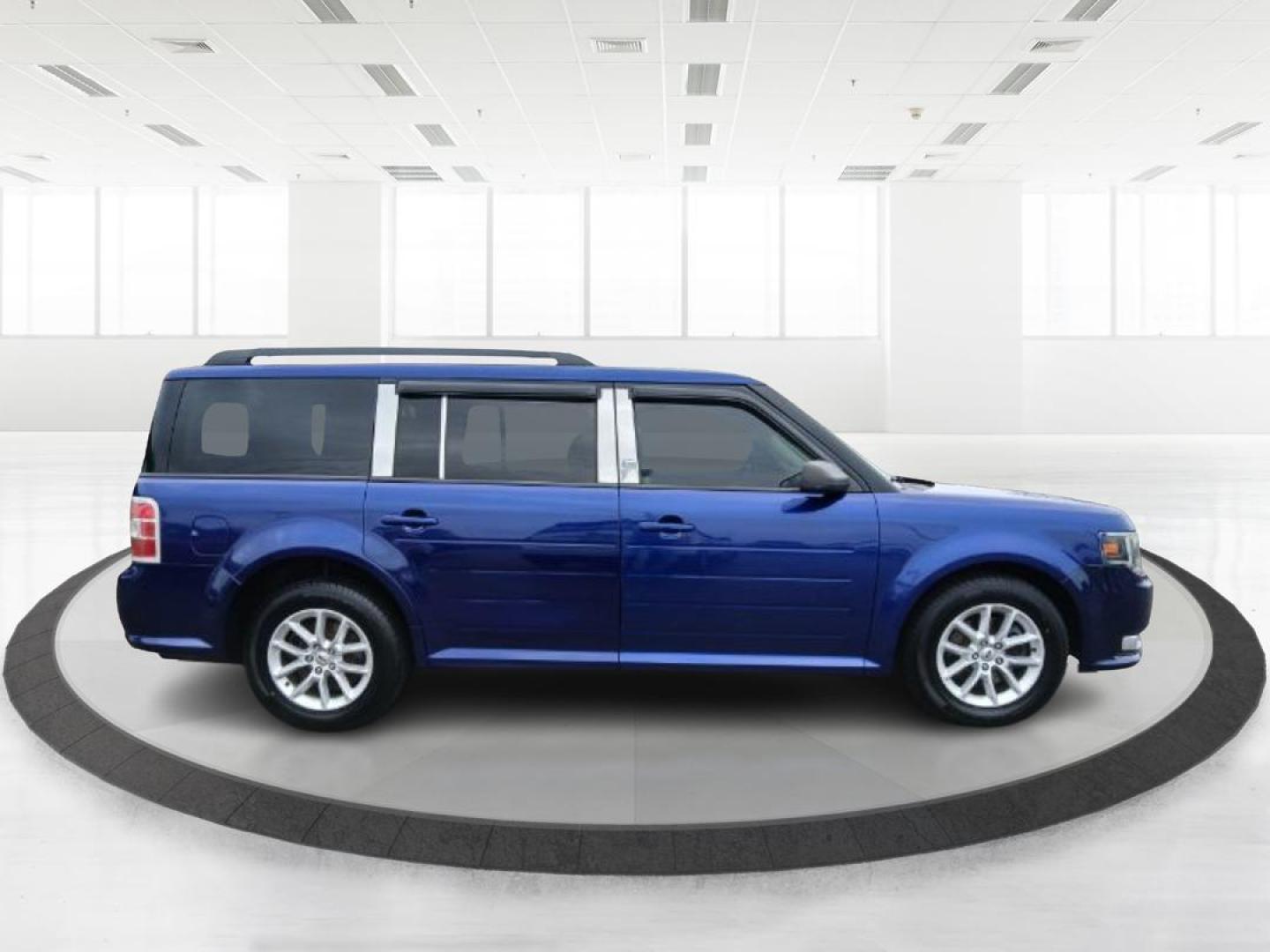 2013 Deep Impact Blue Metallic Ford Flex SE FWD (2FMGK5B8XDB) with an 3.5L V6 DOHC 24V engine, 6-Speed Automatic Overdrive transmission, located at 1951 S Dayton Lakeview Rd., New Carlisle, OH, 45344, (937) 908-9800, 39.890999, -84.050255 - 2013 Ford Flex SE FWD - Photo#1