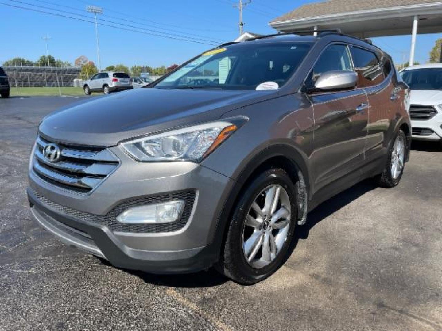 2013 Mineral Gray Hyundai Santa Fe Sport 2.0 FWD (5XYZU3LA8DG) with an 2.0L L4 DOHC 16V engine, 6-Speed Automatic transmission, located at 1184 Kauffman Ave, Fairborn, OH, 45324, (937) 908-9800, 39.807072, -84.030914 - Photo#1